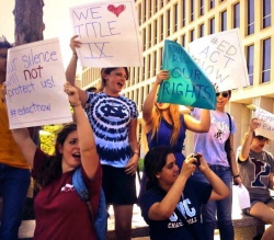 Students protest outside of the Department of Education, demanding better Title IX enforcement (photo courtesy of Feministing).